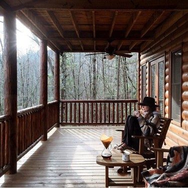 enjoying coffee on the porch of a cabin worth buying