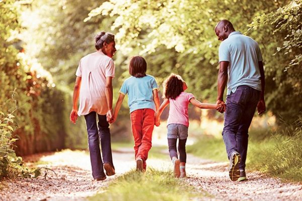 Family running to the cabin of their dreams