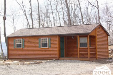 Single wide cabin with a corner porch