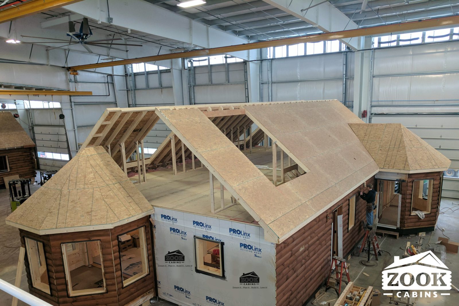 Log Cabins built in a manufacturing facility