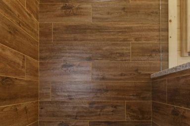 American Estates Saddle Shower Wall Tile Options for your Log Cabin